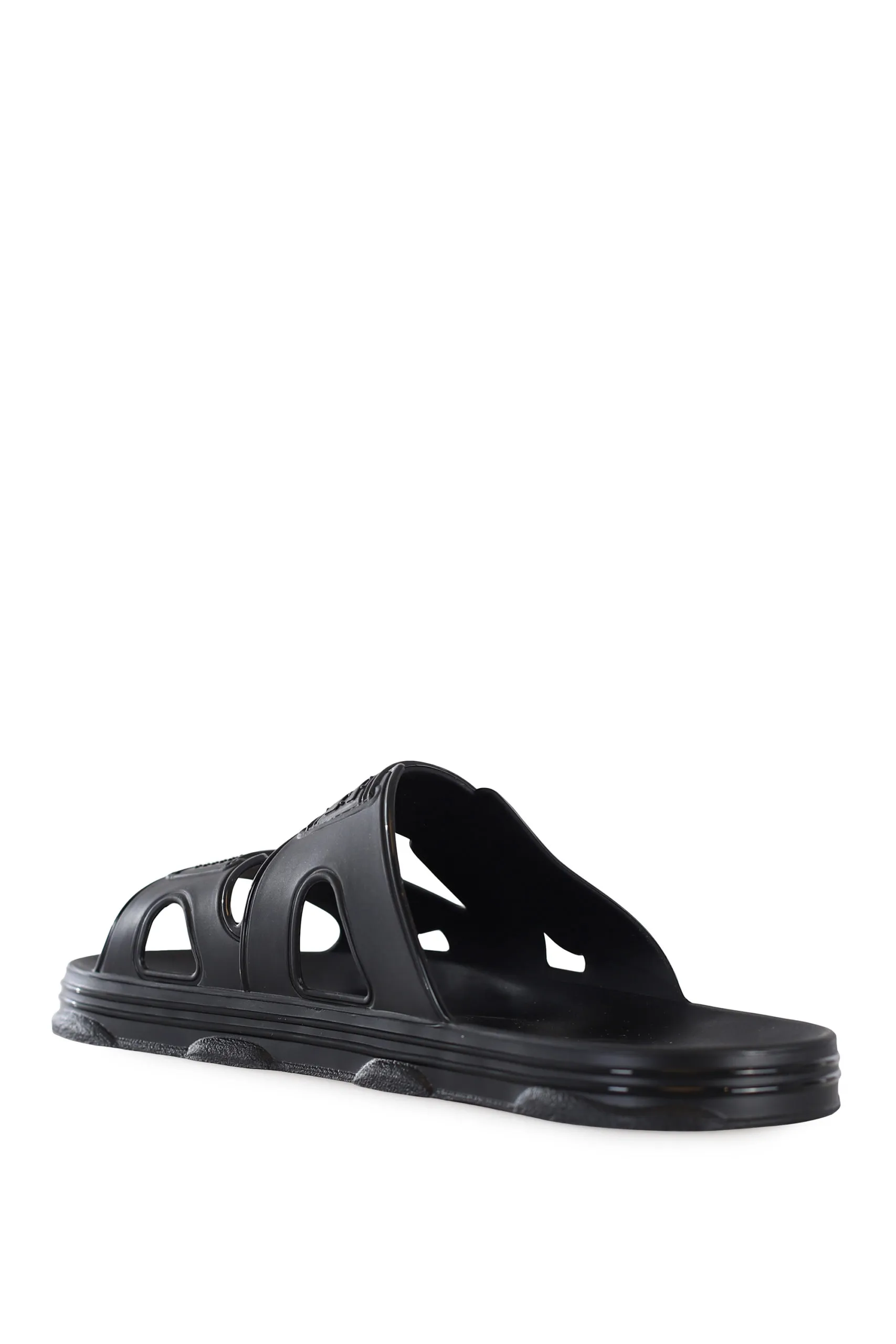 Chanclas negras de goma con logo blanco