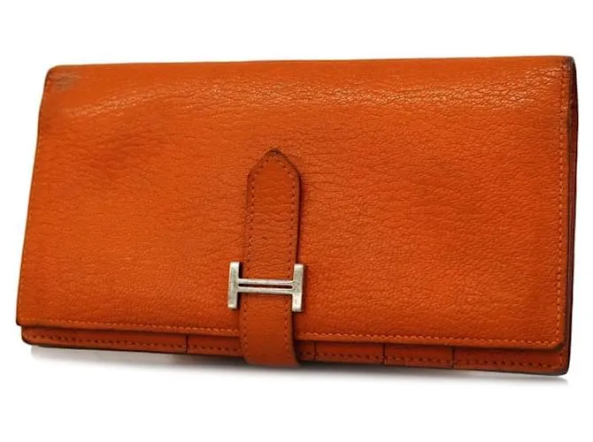 Monedero de cuero Chevre Mysore de Hermès en naranja 