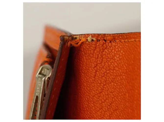 Monedero de cuero Chevre Mysore de Hermès en naranja 