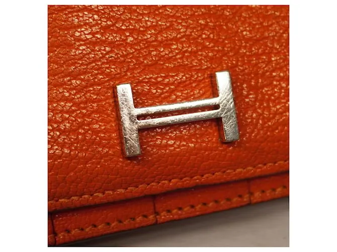 Monedero de cuero Chevre Mysore de Hermès en naranja 