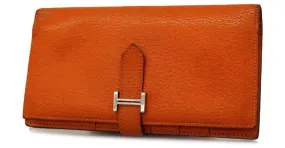 Monedero de cuero Chevre Mysore de Hermès en naranja 