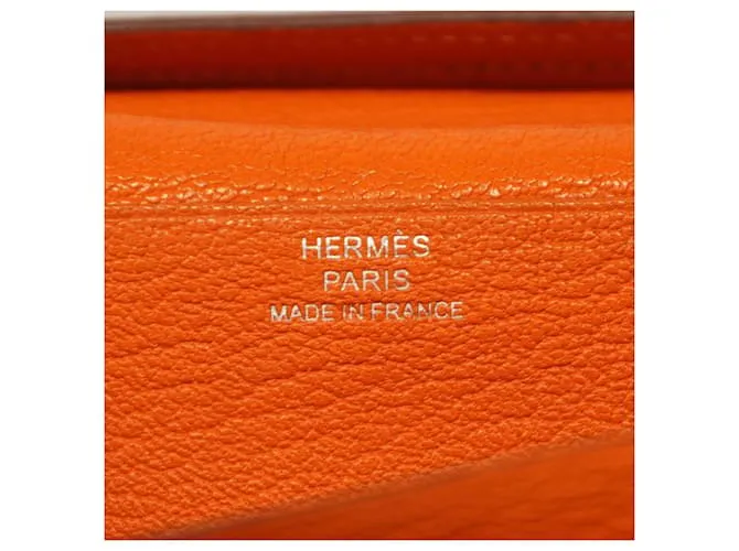 Monedero de cuero Chevre Mysore de Hermès en naranja 