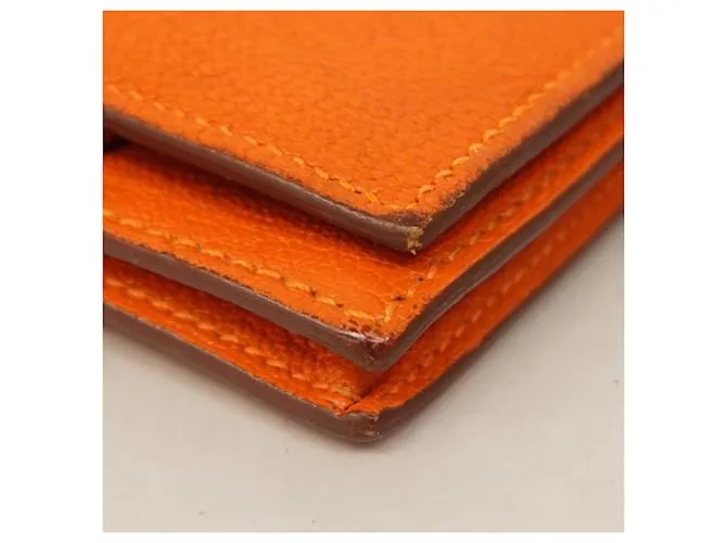 Monedero de cuero Chevre Mysore de Hermès en naranja 