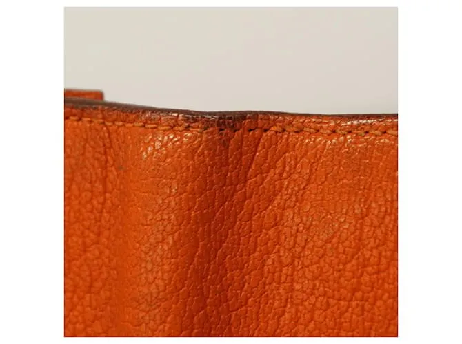 Monedero de cuero Chevre Mysore de Hermès en naranja 