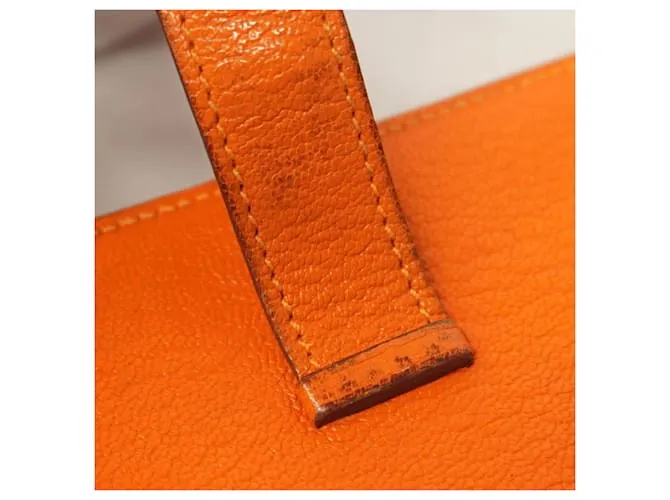 Monedero de cuero Chevre Mysore de Hermès en naranja 