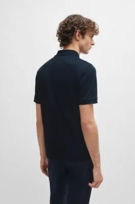 Polo slim fit de algodón con estructura y tapeta de cremallera